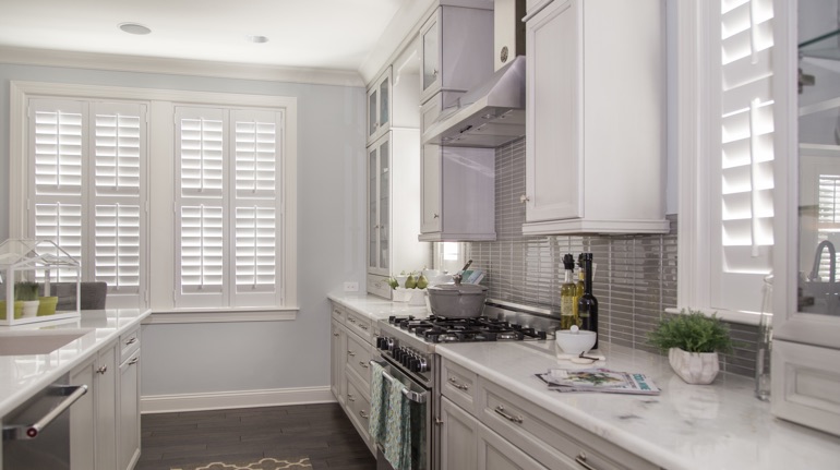 Polywood shutters in Houston kitchen with modern appliances.